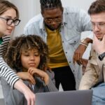 group-reviewing-work-on-computer