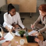 women-working-together-around-table